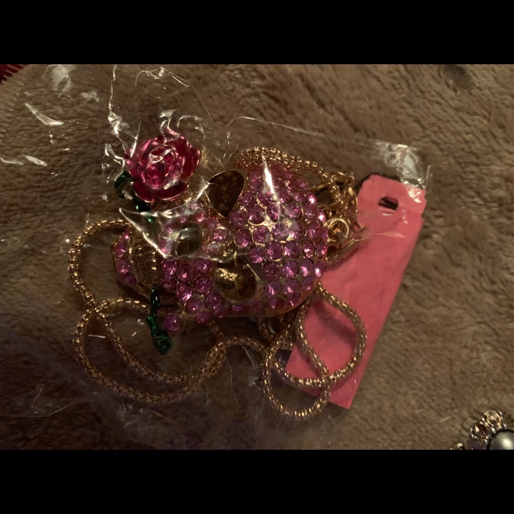 Betsy Johnson pink skull with Rose in it’s mouth